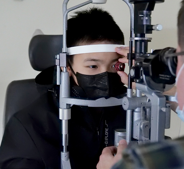 Matthew having an eye exam at SickKids    