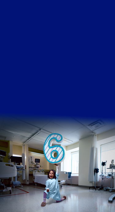 Asiya, a SickKids patient holding up a giant number 6 in a strong pose.