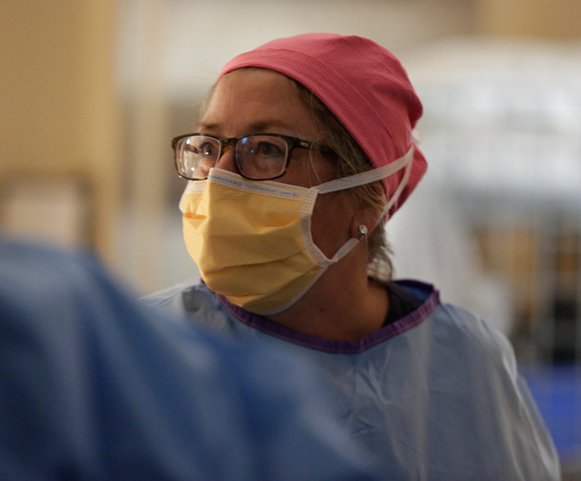 surgeon with mask and scrubs